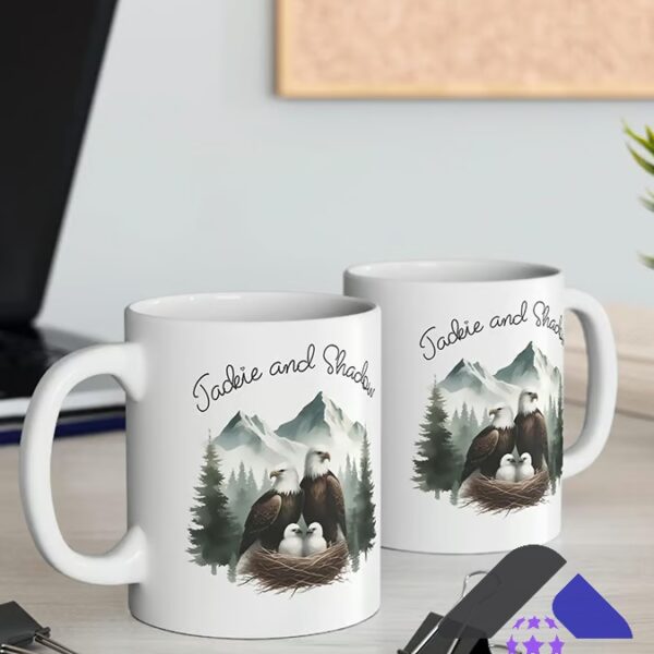 Eagles Family Jackie and Shadow Mountain Nest Mug - two mugs displayed on a light wooden desk