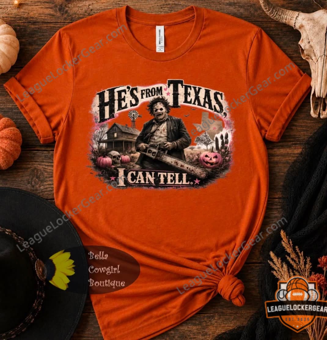Leatherface He's From Texas I Can Tell Halloween T-Shirt – Front view on wooden background Leatherface He's From Texas I Can Tell Halloween T-Shirt - front view on wooden background with pumpkins