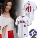 Los Angeles Angels Sui Limited Edition Baseball Jersey - full view with cap and fan in background