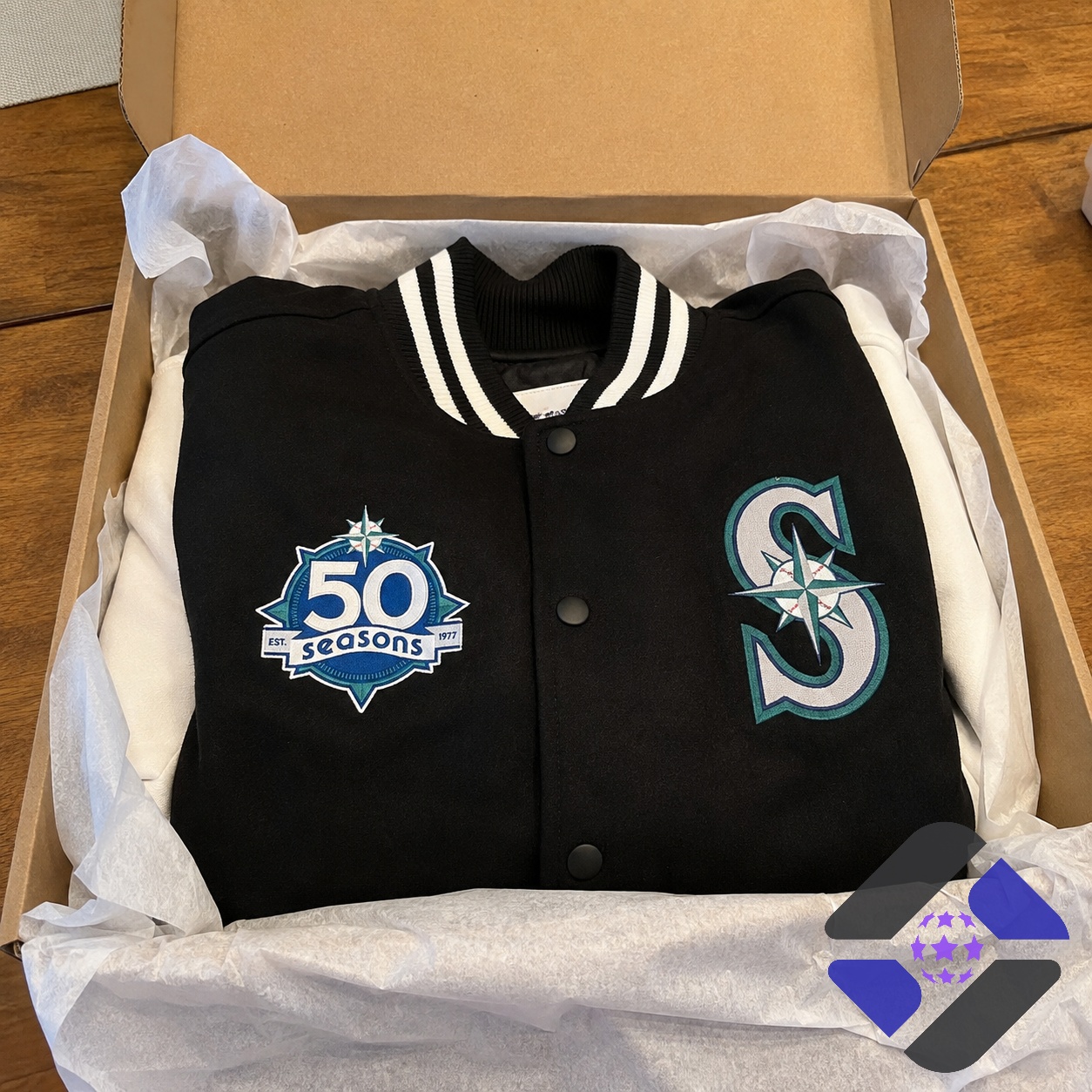 Seattle Mariners 50 Seasons Anniversary Jacket - close-up of former players in jackets, one holding a trident